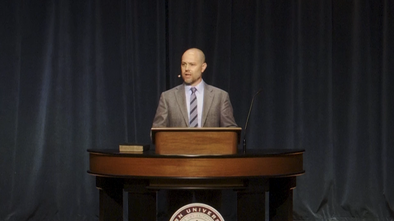 Jared Bryant behind chapel podium