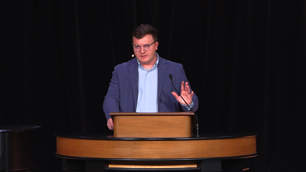Andrew Gordon behind chapel podium